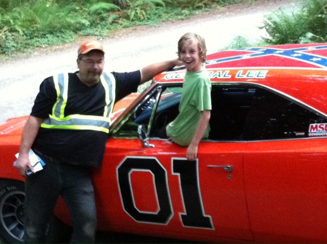 Canadian Rebel redneck Darcy Vickery shows off his General Lee to my  son, Michael.